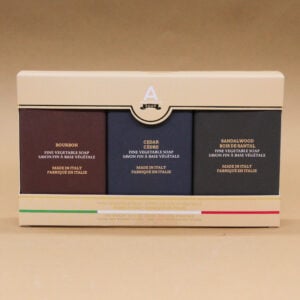 case containing three wrapped solid soaps from the Alchimia soap men's line, bourbon, cedar, sandalwood